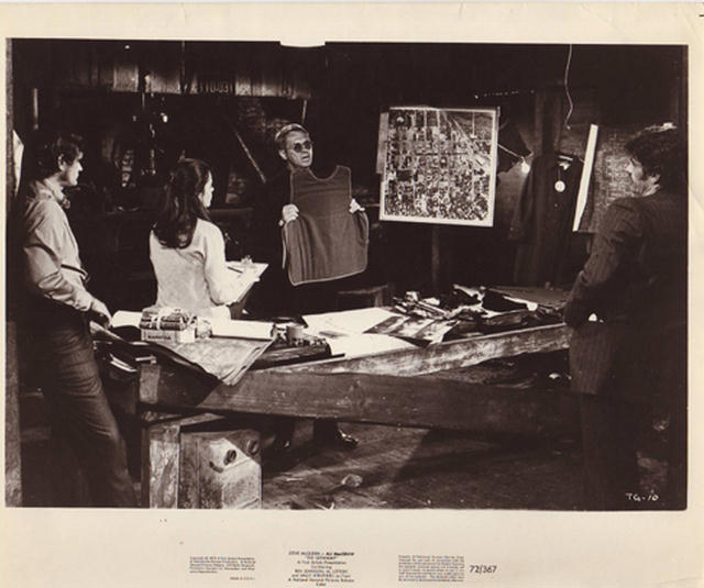 The crew discuss the heist plan.